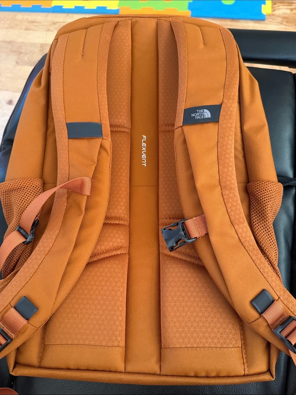 The North Face Jester Backpack in burnt orange with black accents